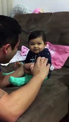 this adorable baby fake crying when her father tries to cut her nails.