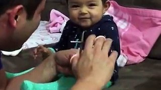 this adorable baby fake crying when her father tries to cut her nails.