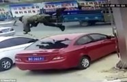 CCTV footage show the moment a 'lucky' man falls on top car