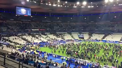 People in stadium after terror in Paris France