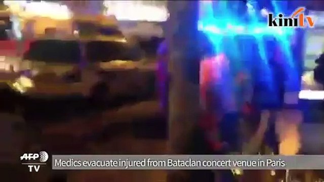 Medics evacuate injured from Bataclan concert venue in Paris