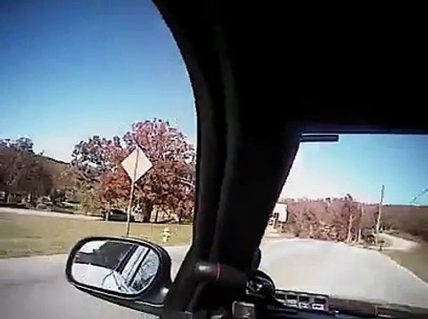 Crazy girl trying to crush a cop with her car and shooting him with a gun