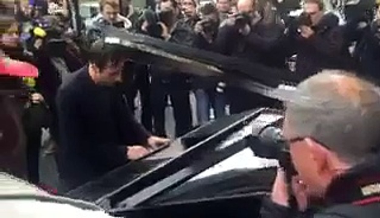 Man plays John Lennon's 'Imagine' on a mobile piano outside the #Bataclan #Theatre