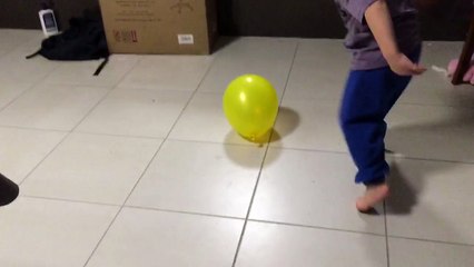 Lorelai (3.5yo, July 2015) with a balloon while sisters and brothers are sleeping.