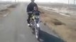 A 2 year old baby riding a bike in Pakistan - Very Dangerous