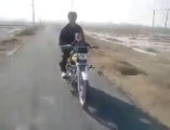 A 2 year old baby riding a bike in Pakistan - Very Dangerous