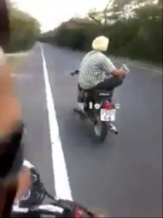 amazing sardar g reads news paper while bike ri...