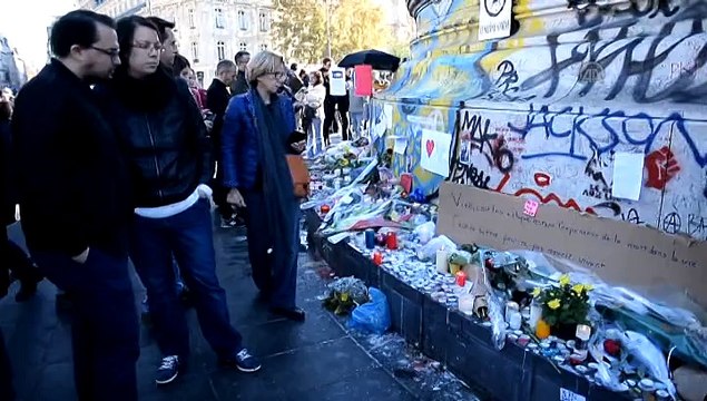 People lay flowers for Paris terror attacks victims