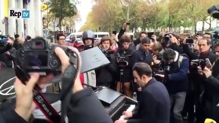 man plays immagine by john lennon at piano near bataclan at at paris attack