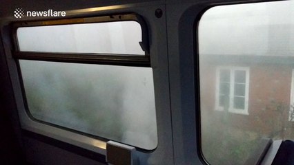 Smoke pours from Surrey commuter train