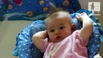 Baby girl hair sways while she swings