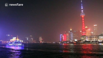 Shanghai lights up landmark in French national colours after Paris attacks