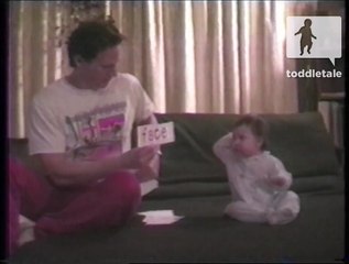 Baby plays charades with her daddy