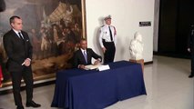 President Obama Signs a Condolence Book at the French Embassy