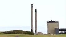 two power station chimney stacks are demolished in a controlled blast in Scotland