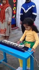 cute girl playing piano