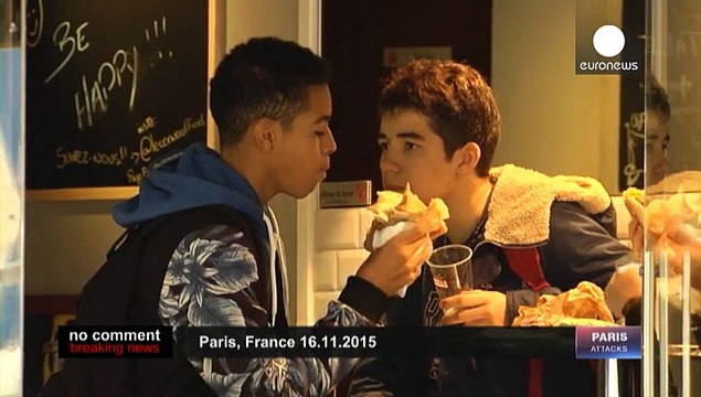 Parisians united in defiance and grief