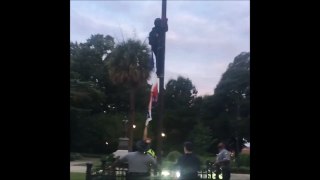 Woman Climbs Pole and Removes Confederate Flag from South Carolina Capitol