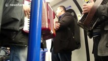 Impromptu Jingle Bells performance on London tube