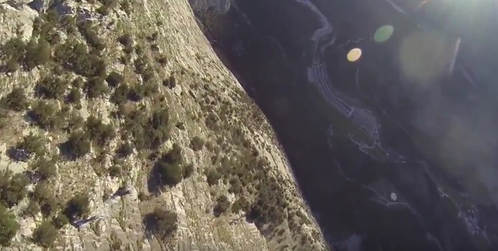 Daredevil Glides Down Steep Cliff in a Wingsuit