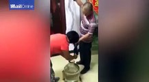 Live snake drowned in bottle to make traditional wine