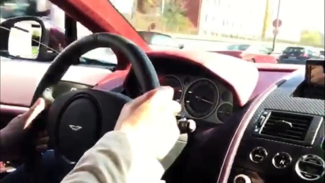 Aston Martin V12 Vantage S driving chasing on the Autobahn