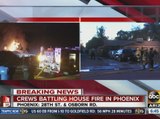 Crews battle house fire in Phoenix