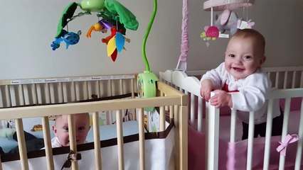 Twin babies can't stop giggling at each other