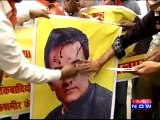 BJP protesters burn and blacken posters of actor Aamir Khan following his comments on intolerance in the country.
