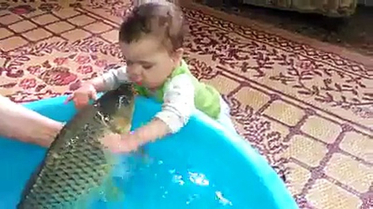 kid kissing a fish :-D