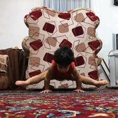 Little Boy Holds Himself Up Doing Splits