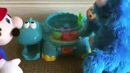 Mario vs Cookie Monster Poppity Pop Musical Dino Ball Popper Dinosaur made by Fisher-Price