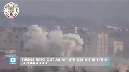 Sirens ring out as air strikes hit IS Syria stronghold