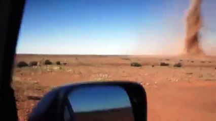 Crazy guys walks through tornado