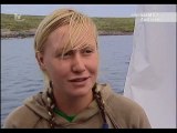 Blonde woman diver in shark cage