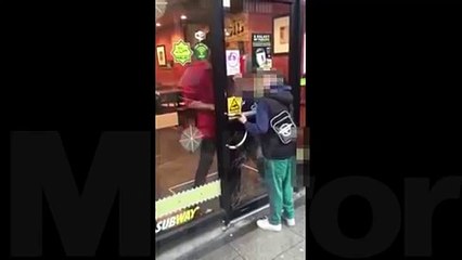Child locked in Subway restaurant and dragged away by worker as friends try to smash door down