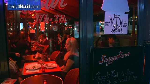 Defiant Parisians enjoy bistro life just days after attacks
