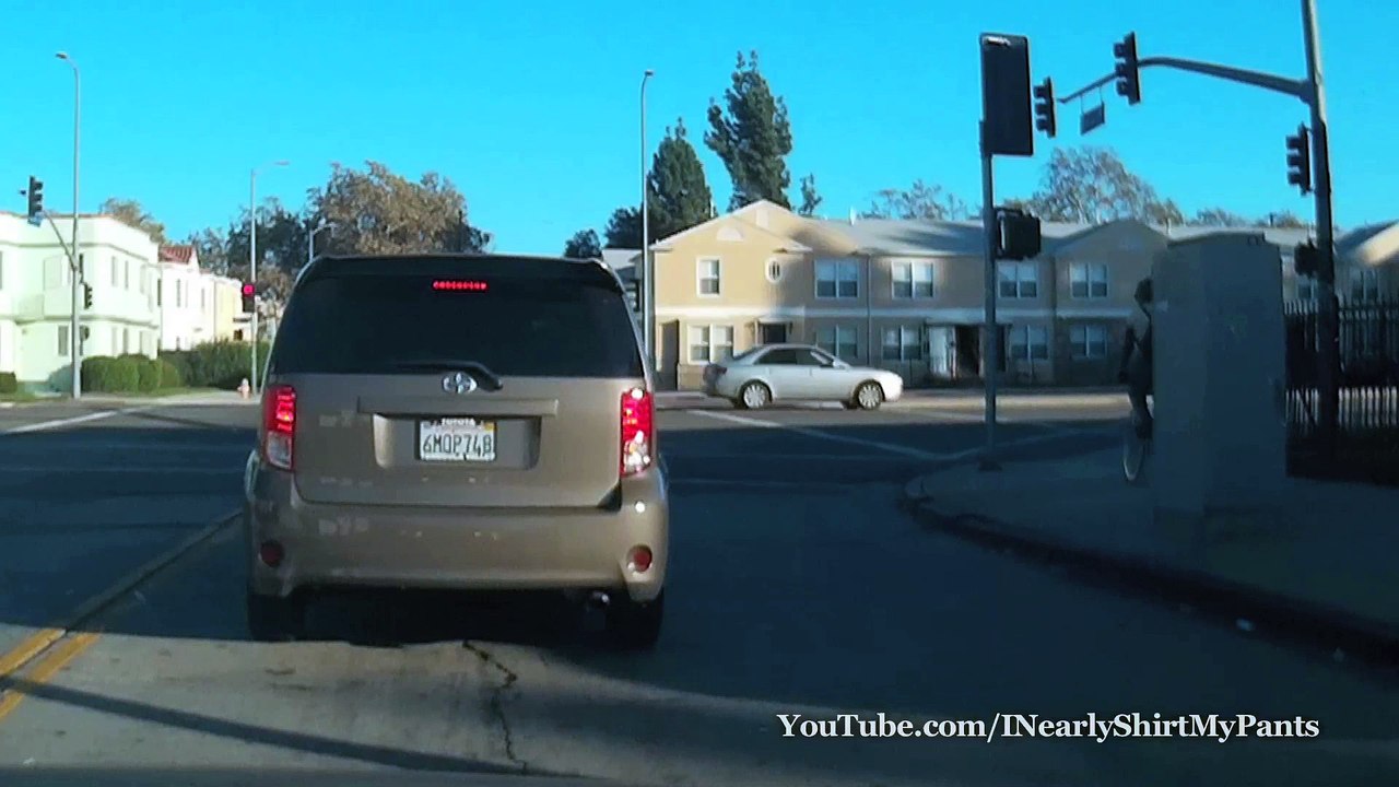 Biker Yelling Then Runs Red