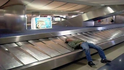 Sleeping Man Takes a Ride on Baggage Claim