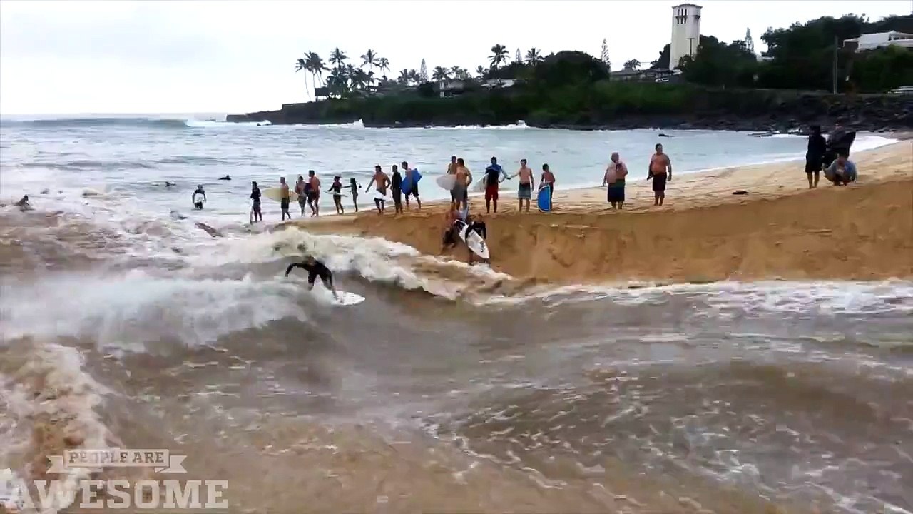 Surfing on a flooded river near the ocean