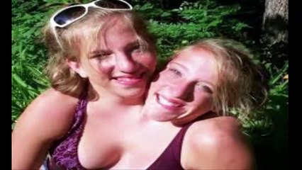 this woman has two head and she looks happy