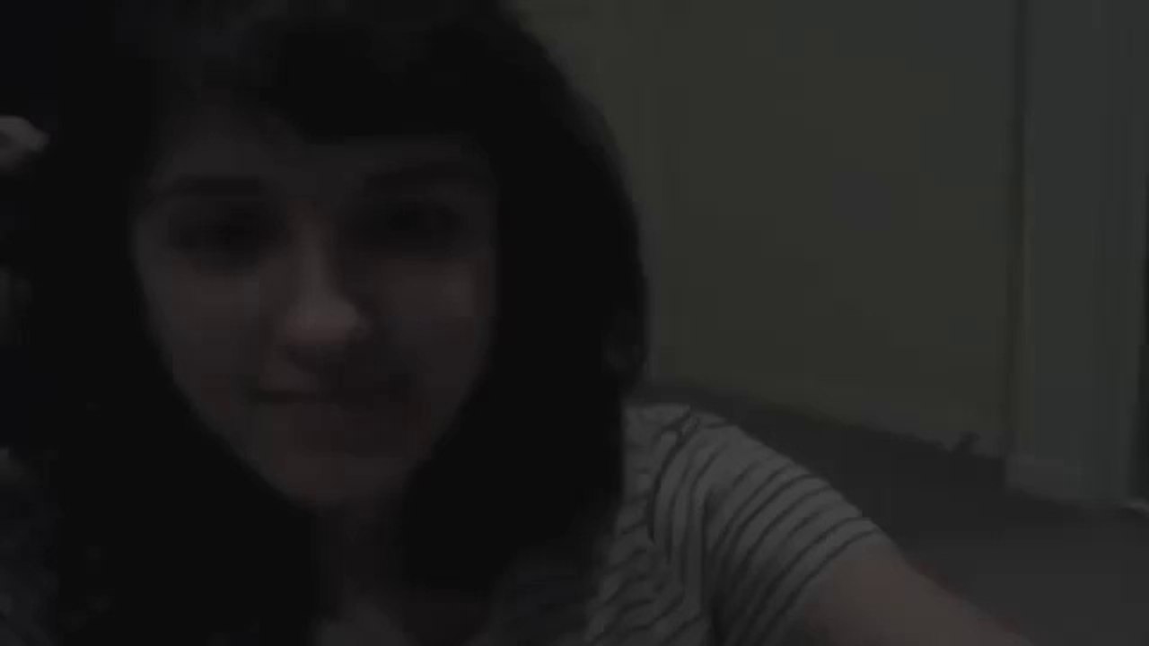A cute girl singing admirable Indian song