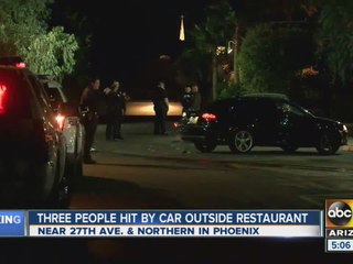 Driver hits three people in parking lot