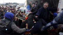 Police, migrants clash on Macedonia border; soldiers build fence