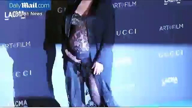 Kim Kardashian shows off baby bump in sheer jumpsuit at gala