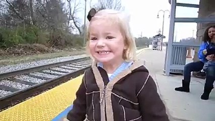 cute little girl very curious about travelling in train