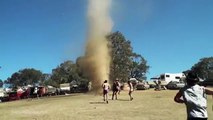 Moment revellers dance around a small tornado at Earthcore