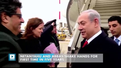 Netanyahu and Abbas shake hands for first time in five years