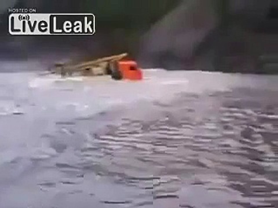 Truck going over river in Russia