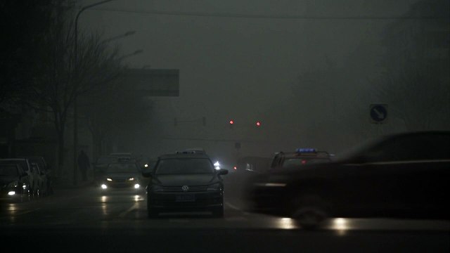 Beijing cloaked in smog as schools, factories close